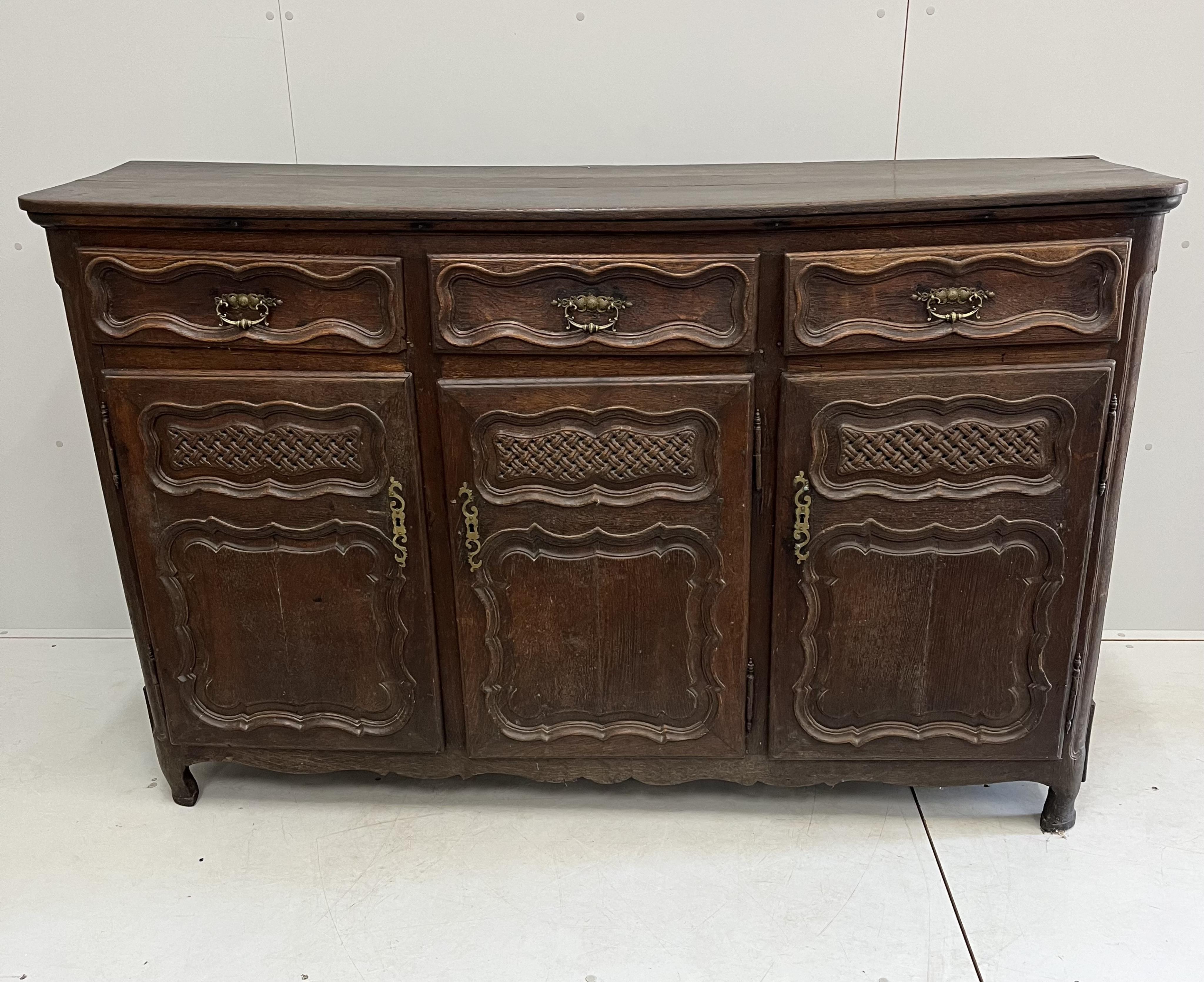 An 18th century French oak buffet, width 171cm, depth 48cm, height 109cm. Condition - fair